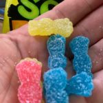 handful of sour patch kids candy